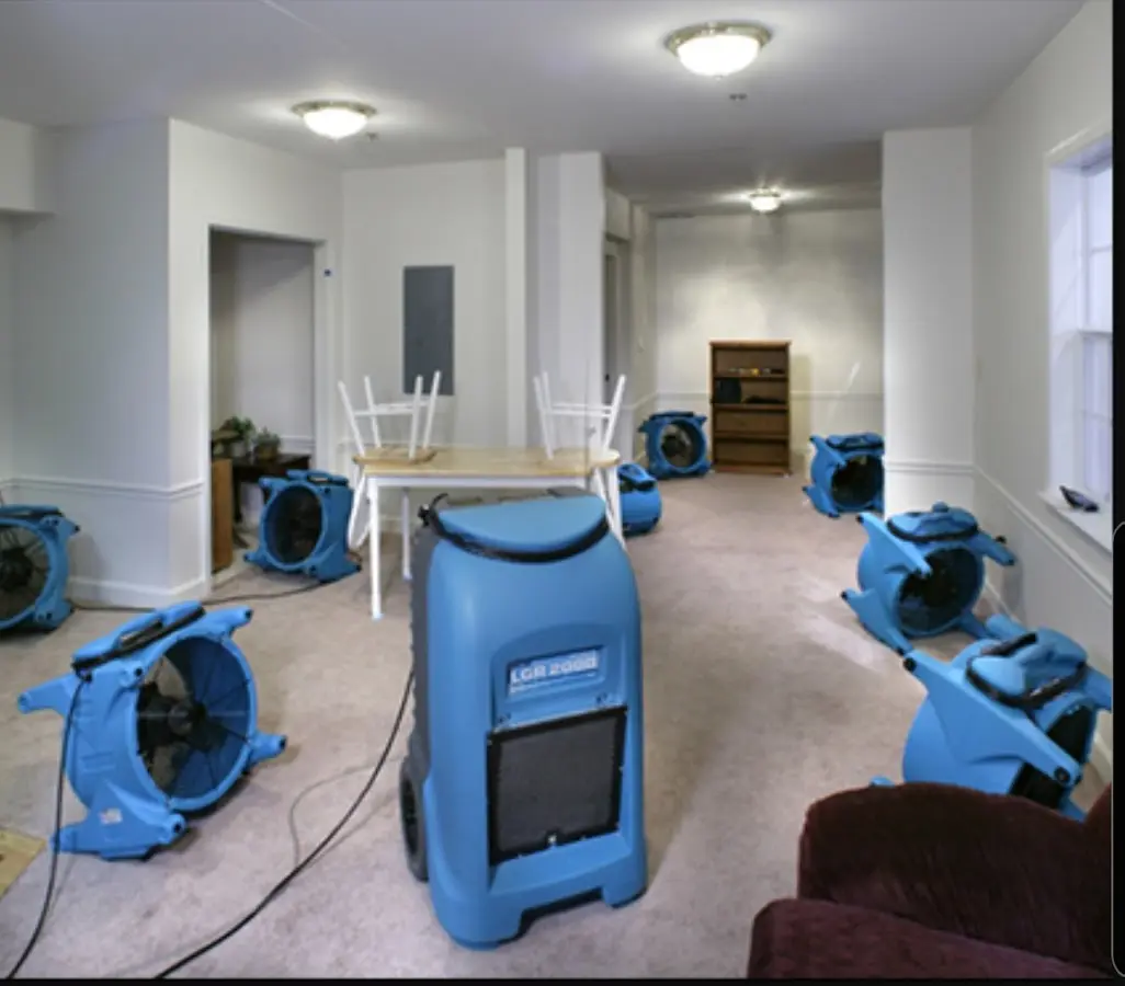 Air movers and dehumidifier setup for Water Damage Restoration in Maize